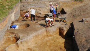 Nuclear physics and machine learning for archaeology